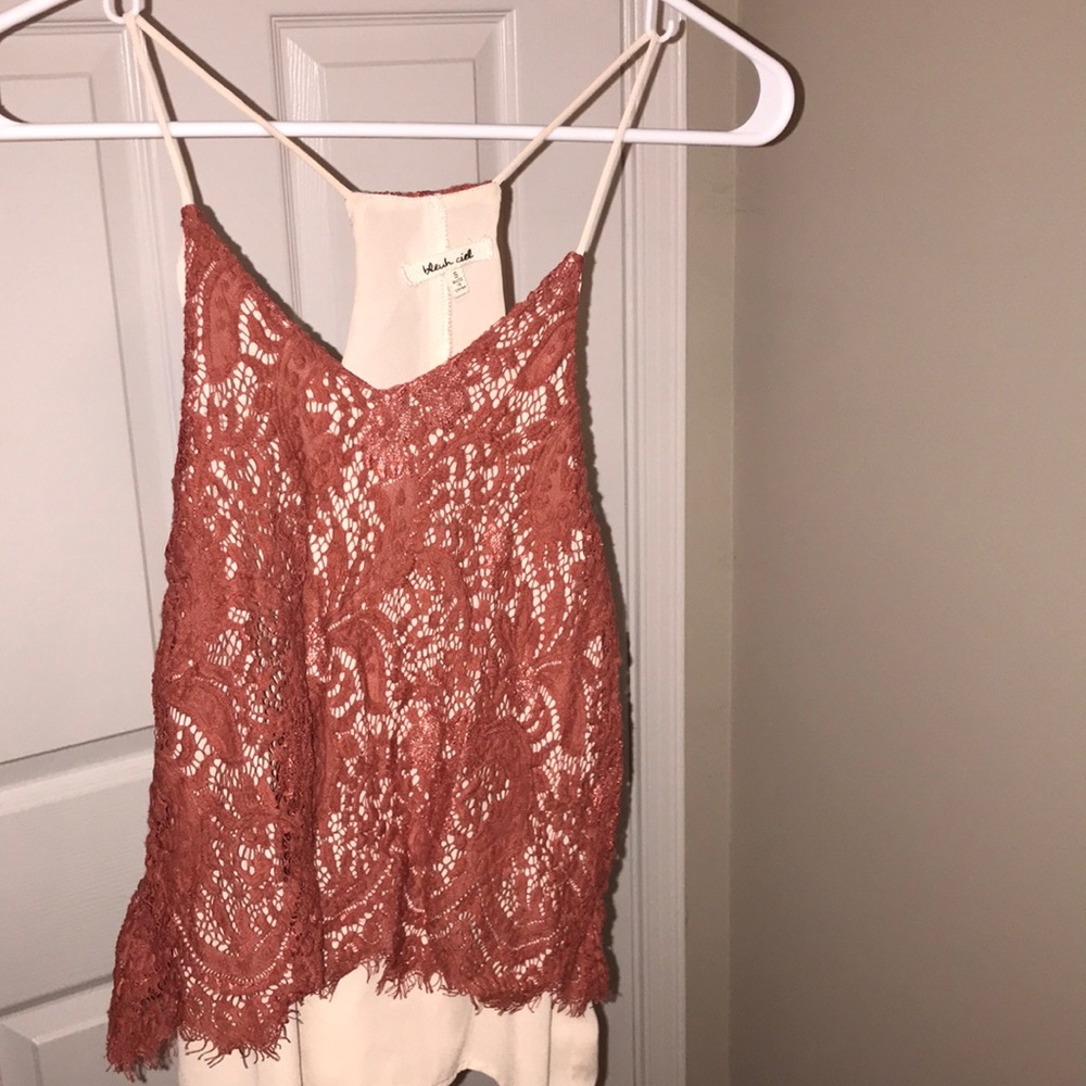 burnt orange lace over a creme silk blouse